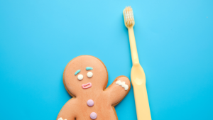 gingerbread man holding toothbrush